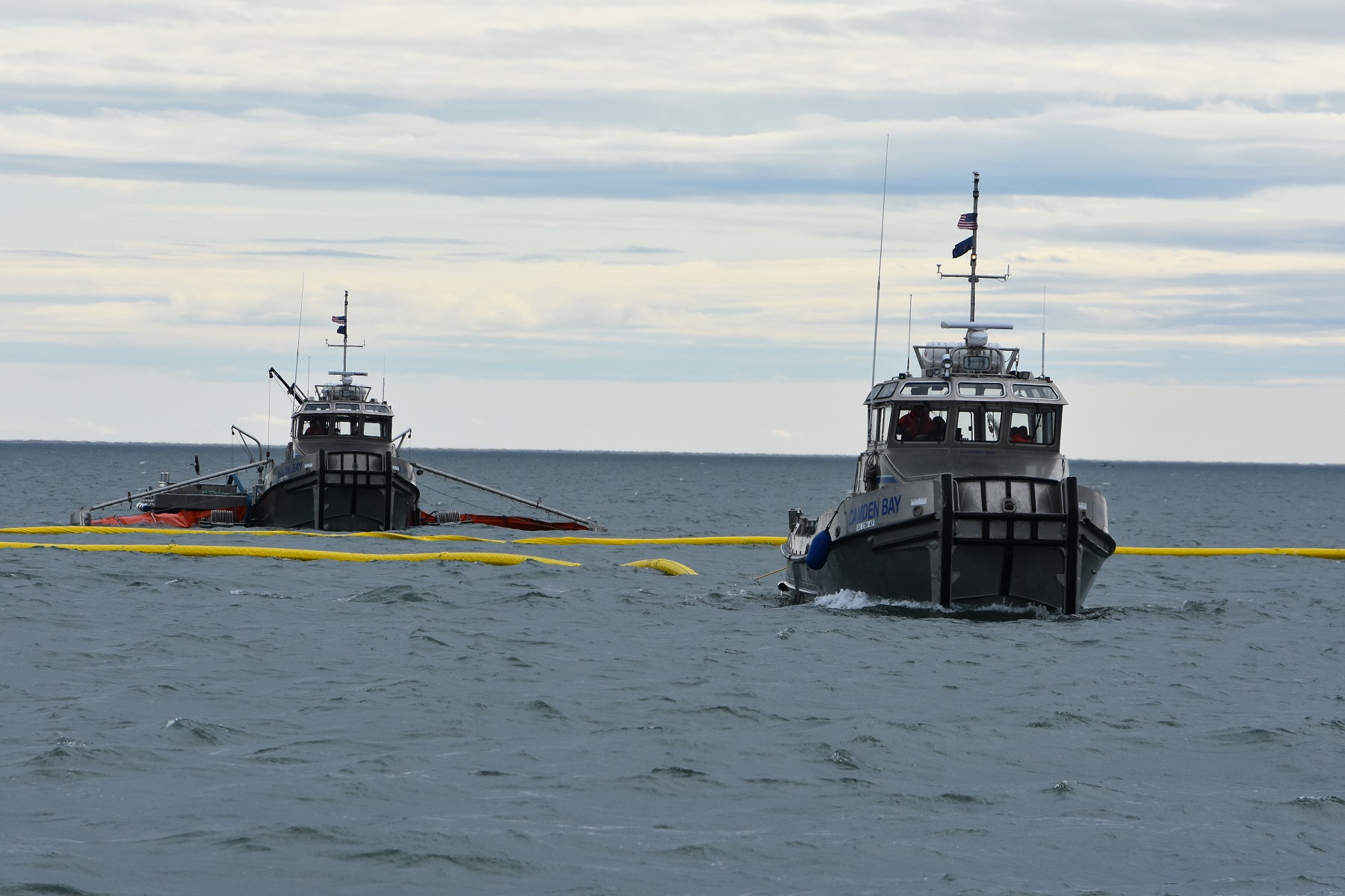 Spill Response Team practicing nearshore recovery Tactic R-20 U-Boom with Open Apex to Skimming System.