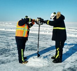 Practicing oil detection and delineation under-ice (Tactic T-3) on the sea ice using ice auger